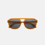 Orange sunglasses with dark lenses on a light gray background