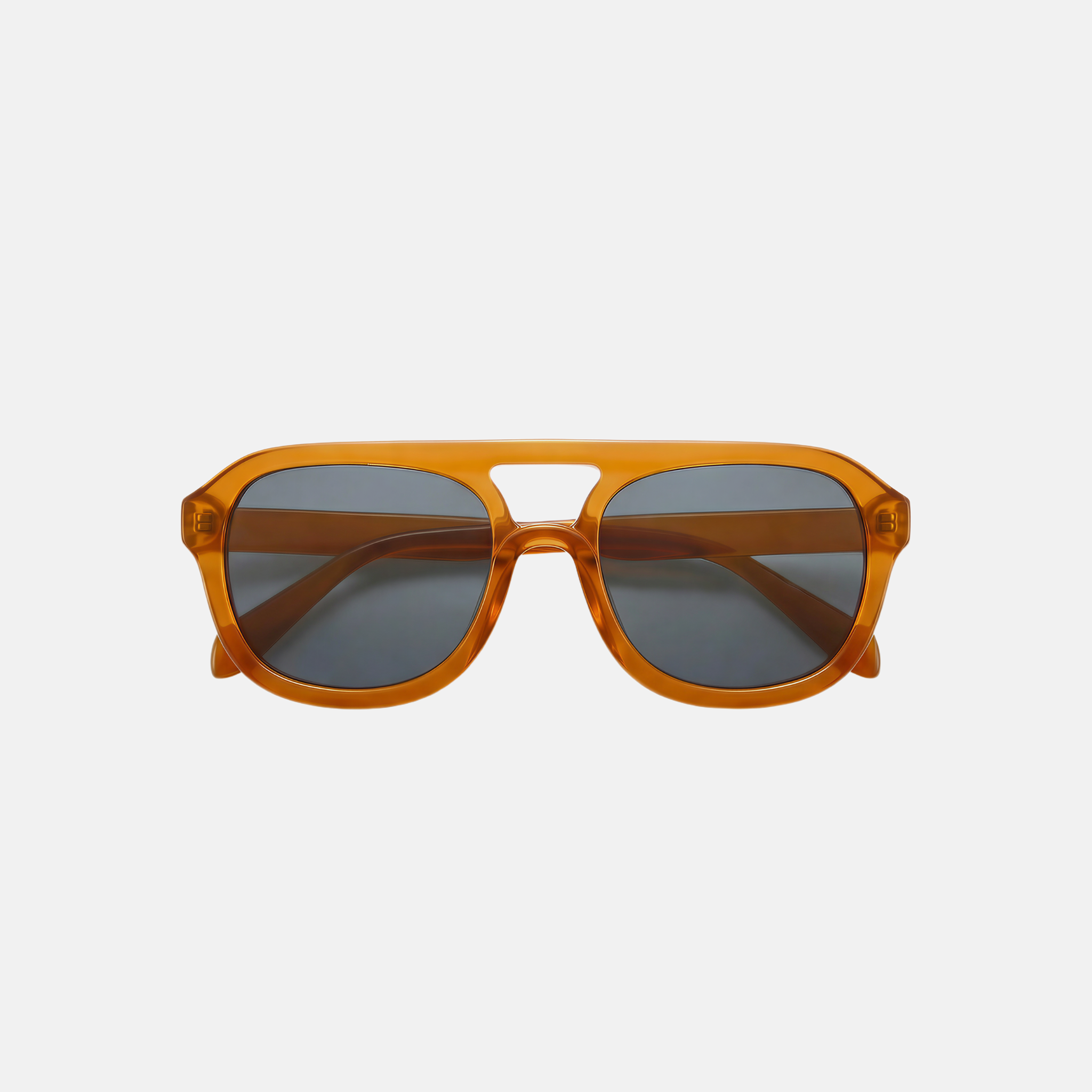 Orange sunglasses with dark lenses on a light gray background