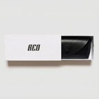 Black pouch inside a white box with 'REO' branding on a light gray background