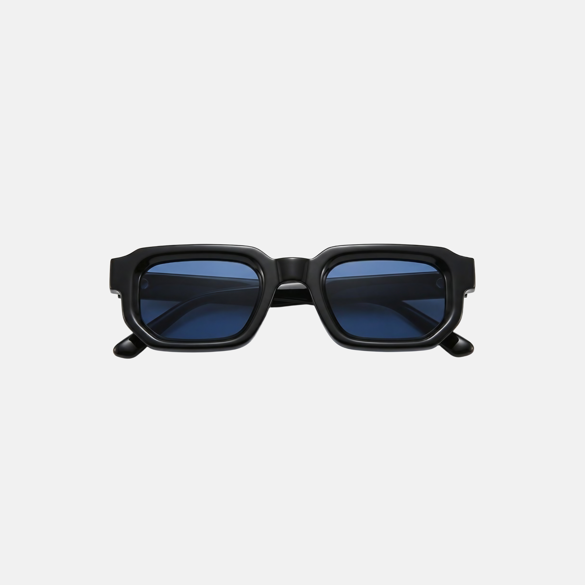 Black sunglasses with blue lenses on a light gray background
